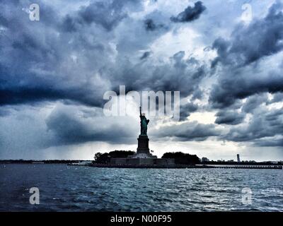 Manhatten, New York, USA. 19th June, 2017. Statue of Liberty in a summer storm Credit: Si Duke/StockimoNews/Alamy Live News Stock Photo