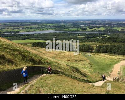 UK Weather: Sunny morning in Rivington. Family walking down from Rivington Pike in Rivington near Chorley in Lancashire Stock Photo