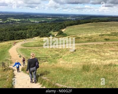 UK Weather: Sunny morning in Rivington. Family walking down from Rivington Pike in Rivington near Chorley in Lancashire Stock Photo