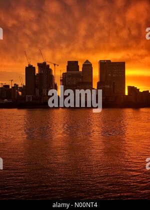 London, UK. 30th April, 2018. Sunset at Canary Wharf, London Credit: Tristan Luker Photography/StockimoNews/Alamy Live News