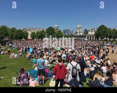 Windsor, UK, 19 May 2018. Crowds watching a live screening of the Royal wedding of Harry and Meghan at the National Maritime Museum in Royal Greenwich in London England Credit: richard chandler/StockimoNews/Alamy Live News Stock Photo