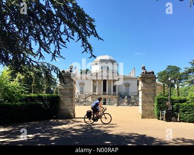 UK Weather London, England 18 June 2018 A bicyclist enjoying the warm and sunny afternoon at Chiswick House where the temperature reached 26 degrees C. Stock Photo
