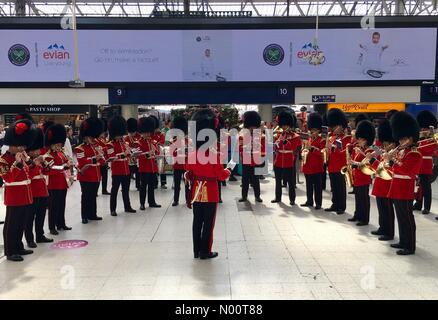 London, UK. 11th July, 2018. Wednesday 11th July 2018 - Waterloo Train Station London - Coldstream Guards orchestra perform to crowds at Waterloo Station Credit: Matthew Woodward/StockimoNews/Alamy Live News Stock Photo