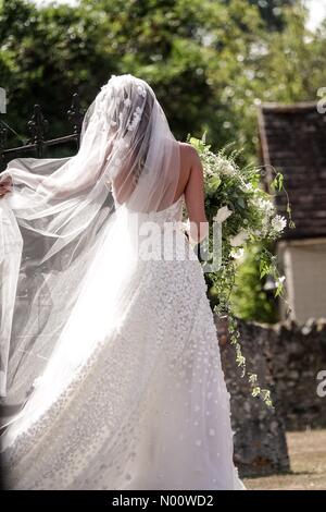 Frensham, UK, 4 Aug 2018. Charlie Van Straubenzee and Daisy Jenks wedding, Frensham, Surrey, UK. The Street, Frensham. 04th August 2018. Daisy Jenks arrives at St Mary's Church, Frensham. Credit: jamesjagger/StockimoNews/Alamy Live News Stock Photo