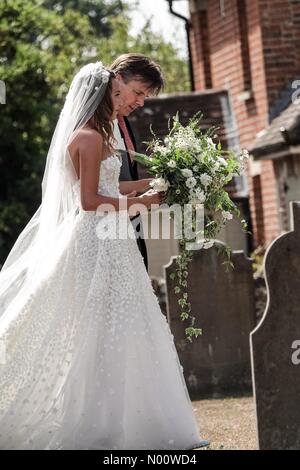 Frensham, UK, 4 Aug 2018. Charlie Van Straubenzee and Daisy Jenks wedding, Frensham, Surrey, UK. The Street, Frensham. 04th August 2018. The bride, Daisy Jenks, arrives at St Mary's Church, Frensham. Credit: jamesjagger/StockimoNews/Alamy Live News Stock Photo