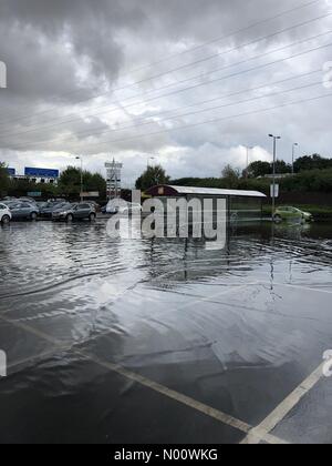 London Colney, St Albans, UK. 10th Aug, 2018. Flooded car park at Colney Fields, London. Heavy rain followed dry weather in the UK. Credit: ianbakersport/StockimoNews/Alamy Live News Stock Photo