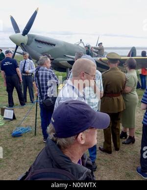 Lancashire, UK. 18th August 2018. Re-enactors with their replica Spitfire Mk 9 attract much attention at the Lytham Wartime 1940's Nostalgia Weekend. Credit: Roger Goodwin/StockimoNews/Alamy Live News Stock Photo