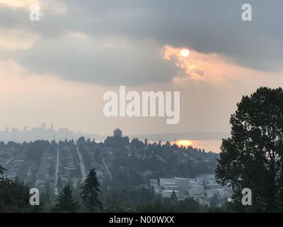 Vancouver, BC, Canada, 23rd August, 2018. As viewed from Burnaby, smoke from distant wildfires lingers over Vancouver. Air quality has improved since yesterday, but an advisory is still in effect. Credit: Maria Janicki/StockimoNews/Alamy Live News