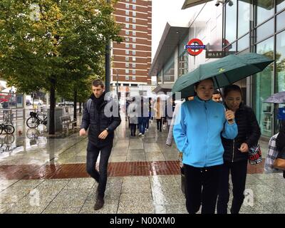 Shepherd's Bush, London. 6th Oct 2018. UK Weather: People use umbrellas to shelter from the rain in Shepherd's Bush, London. Credit: Matthew Ashmore/StockimoNews/Alamy Live News Stock Photo