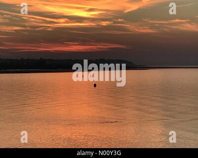 Herne Bay, Kent UK. October 20th 2018. UK Weather. Beautiful deep red sunset over a calm Thames Estuary. A chilly evening. Richard Donovan/Live Alamy News Credit: Richard Donovan/StockimoNews/Alamy Live News Stock Photo
