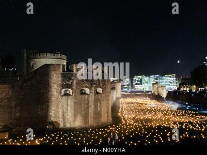 London, UK. 11th Nov, 2018. Rememberance Sunday 2018 at the Tower of London. The moat is lit up with 10,000 flames as part of Beyond the Deepening Shadow Credit: dimple/StockimoNews/Alamy Live News Stock Photo