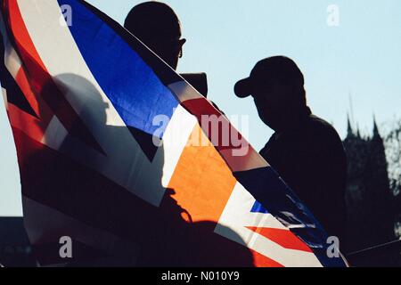 London, UK. 29th March, 2019. Pro Brexit Protestors, in silhouette with Union Jack flag Credit: nickcook78/StockimoNews/Alamy Live News Stock Photo