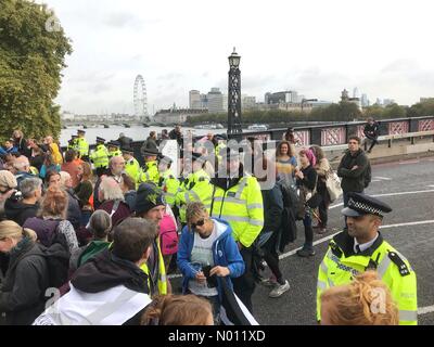 Westminster, London, UK. 7th Oct 2019. Extinction Rebellion XR protest in London UK - Westminster central London, UK - Monday 7th October 2019. Climate change protesters and Police block Lambeth Bridge. Credit: Steven May/StockimoNews/Alamy Live News Stock Photo