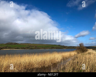 UK Weather: Sunshine and showers at Torcross. A379, Torcross. 06th March 2020. Unsettled weather moving in from the west. Sunshine and showers over Slapton Ley seen from Torcross in South Devon. Credit: jamesjagger/StockimoNews/Alamy Live News Stock Photo