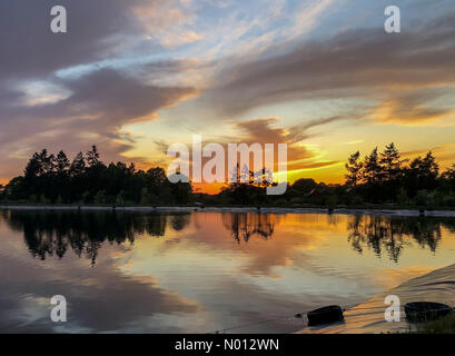 UK Weather: Sunset over Godalming. Tuesley Farm, Godalming. 02nd May 2020. A beautiful end to the day for the Home Counties. Sunset over Tuesley Farm in Godalming in Surrey. Credit: jamesjagger/StockimoNews/Alamy Live News Stock Photo