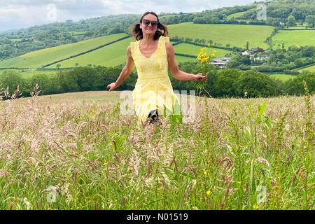 Dunsford, Devon, UK. 5th June, 2021. UK Weather: Raich Keene enjoying Colourful Summer wildflowers under clouds in Dunsford, Devon. Credit: nidpor/Alamy Live News Stock Photo