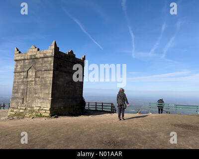 UK Weather: Sunny at Rivington, Lancashire. A sunny Easter Sunday at Rivington near Chorley in Lancashire. A windy morning by the folly at the top of Rivington Pike. Stock Photo