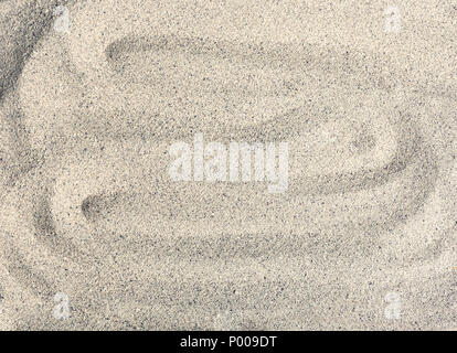 Sea sand, wavy background. Fine granules. Stock Photo