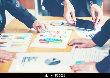 Business adviser analyzing financial figures denoting the progress in the work of the company Stock Photo