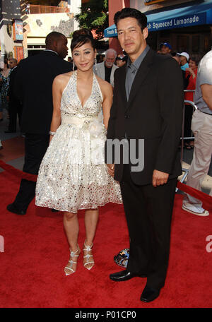 Russell Wong and wife  -  Mummy - Tomb Of The Dragon Emperor  Premiere at the Gibson Amphitheatre Theatre In Los Angeles.  full length eye contact  WongRussell wife 36  Event in Hollywood Life - California, Red Carpet Event, USA, Film Industry, Celebrities, Photography, Bestof, Arts Culture and Entertainment, Celebrities fashion, Best of, Hollywood Life, Event in Hollywood Life - California, Red Carpet and backstage, Music celebrities, Topix, Couple, family ( husband and wife ) and kids- Children, brothers and sisters inquiry tsuni@Gamma-USA.com, Credit Tsuni / USA, 2006 to 2009 Stock Photo