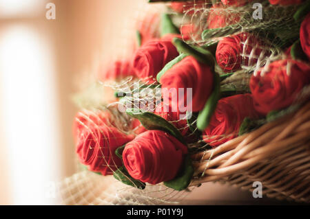 Bunch of red roses in a basquet Stock Photo