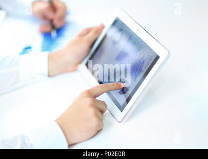 Hands of businessman holding graphic shown on the screen of the touch panel Stock Photo