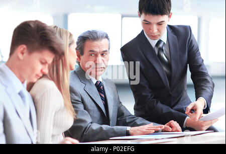 smiling business team discussing something Stock Photo