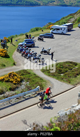 Kylesku Bridge carpark and visitor viewpoint filled with bikers and campervans and part of the North Coast 500 route. Stock Photo
