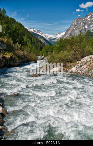 the river in Val Ferret during the melting of snow in spring, Aosta Valley - Italy Stock Photo