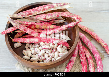 Red kidney beans in wooden bowl, close-up, Stock Photo