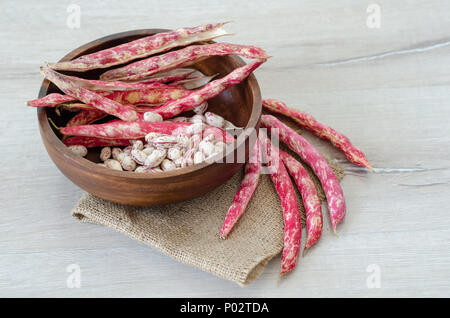 Red kidney beans in wooden bowl, close-up, Stock Photo