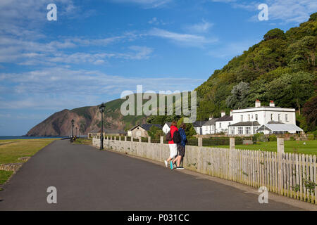 Lynmouth, Great Britain - July 7,2010: The tourists on the promenade in Lynmouth, Great Britain. Lynmouth is a village in Devon, England, on the north Stock Photo