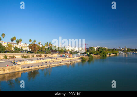 Seville, Spain - November 19,2016: Sunset on the Guadalquivir river. In addition, the river was heavily defended with fortifications since the Middle  Stock Photo