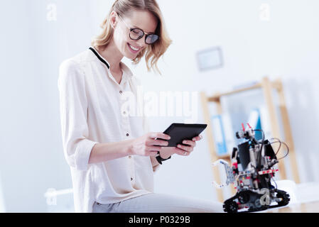 Happy nice woman using a tablet Stock Photo