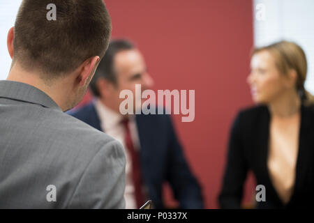 Businessman And Businesswoman In Mediation Meeting Stock Photo