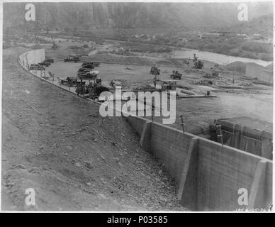 Stewart Mountain Dam. View looking downstream showing backfill along left wall. Note excavation for downstream... - Stock Photo