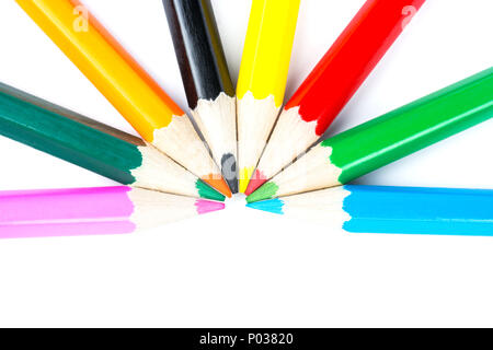 Eight multicolored pencils laid out in a semicircle Stock Photo