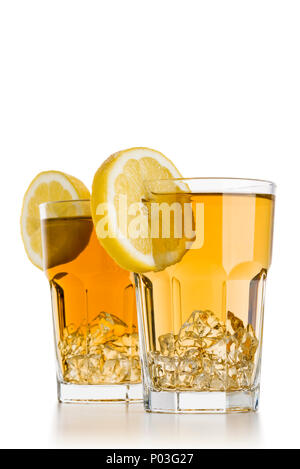 two glasses full of ice tea with lemon slices on white background Stock Photo