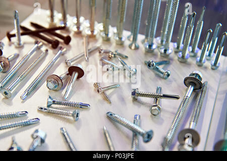 Self-tapping screws on table Stock Photo
