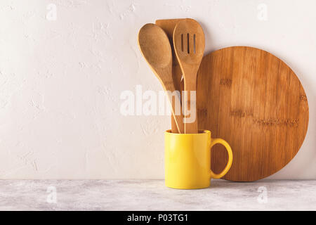 Crockery and cutlery on a light table with copy space. Stock Photo