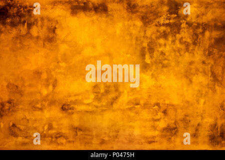 Grunge yellow painted wall texture background. Stock Photo
