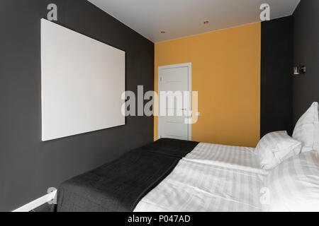 daylight morning. Hotel standart room. modern bedroom with white pillows. simple and stylish interior. Stock Photo