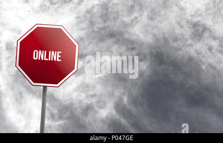 Online - red sign with clouds in background Stock Photo