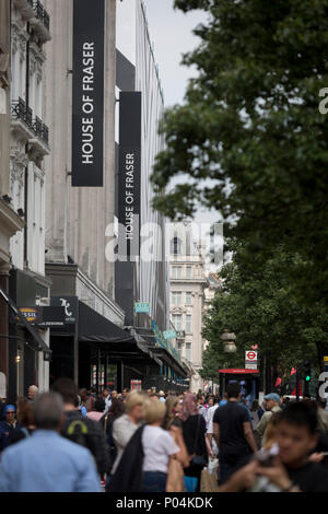 On the day that closures of many branches and the loss of jobs, shoppers are outside The House of Fraser department store on Oxford Street which has been in business for 81 years, on 7th June 2018, in London, England. House of Fraser is to close 31 of its 59 shops, affecting 6,000 jobs, as part of a financial rescue deal. If the plan is approved, 2,000 House of Fraser jobs will go, along with 4,000 brand and concession roles. The stores scheduled for closure, which include its flagship London Oxford Street store, will stay open until early 2019.