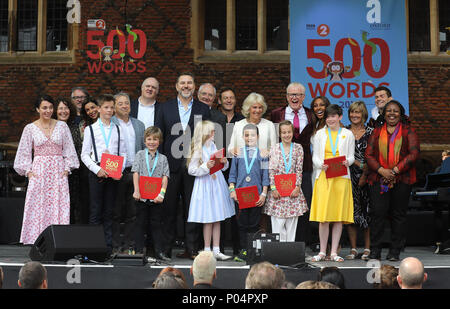 The Duchess of Cornwall (centre right) on stage with celebrities including Amanda Abbingdon, Shobna Gulati, Dara O' Briain, David Walliams, Jim Broadbent, Jason Issacs, Chris Evans and the six winning children at the live broadcast of the final of BBC Radio 2's 500 Words creative writing competition at Hampton Court Palace in East Molesey. Stock Photo