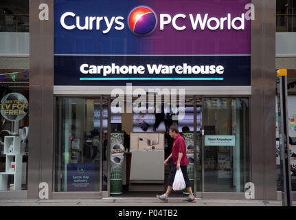 A branch of Currys PC World, with a Carphone Warehouse inside, on Oxford Street, central London. Stock Photo