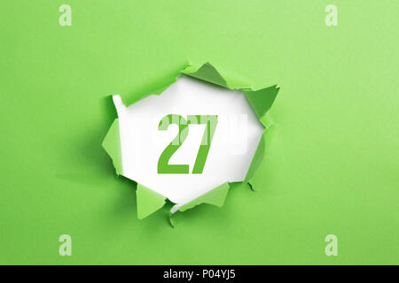 Green Number 83 on green paper background Stock Photo