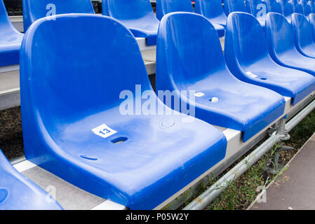 Blue seats at stadium Stock Photo