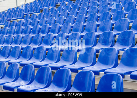 Blue seats at stadium Stock Photo