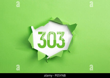 Green Number 303 isolated white background Stock Photo - Alamy